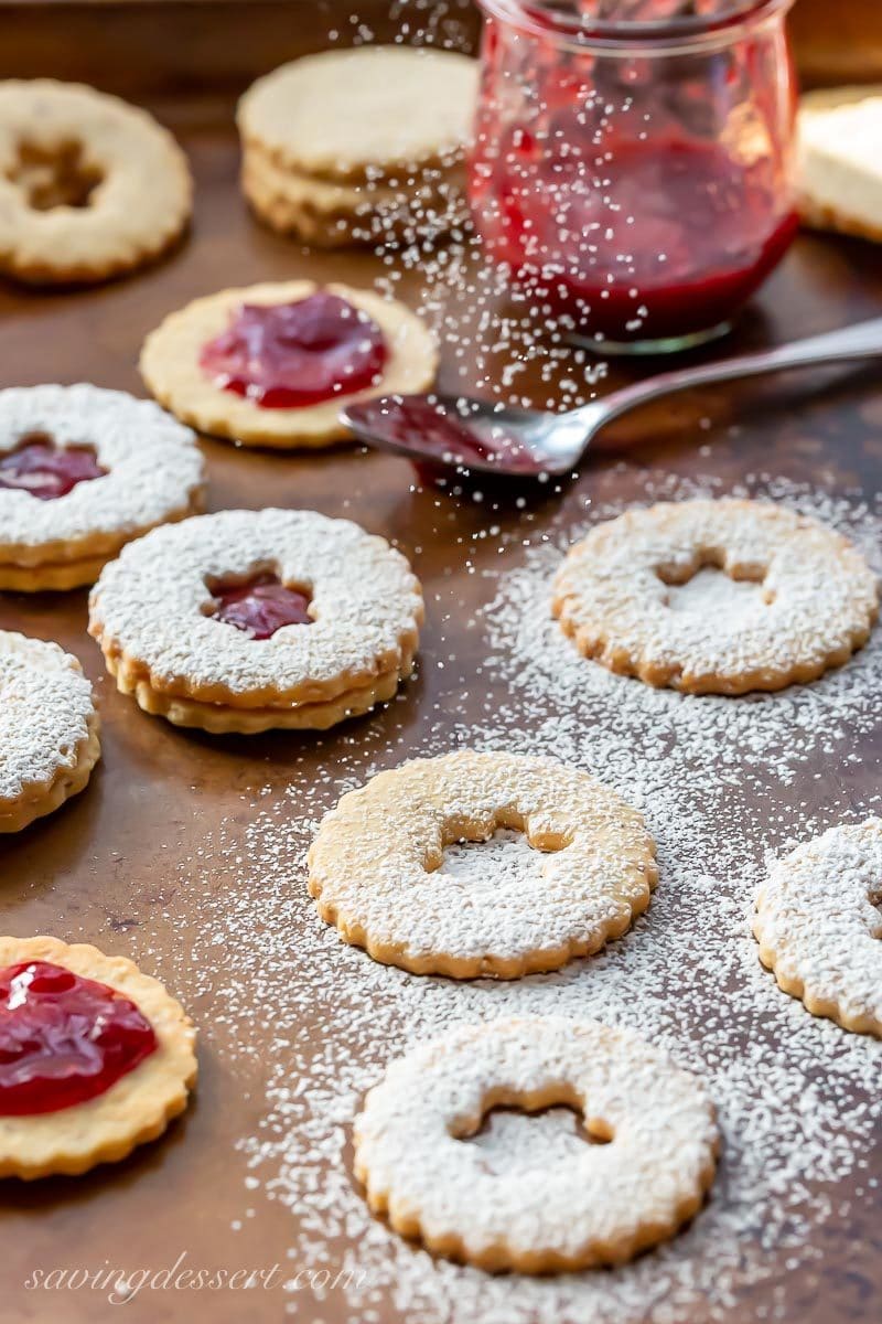 Powdered sugar sprinkled on Linzer cookies filled with jam