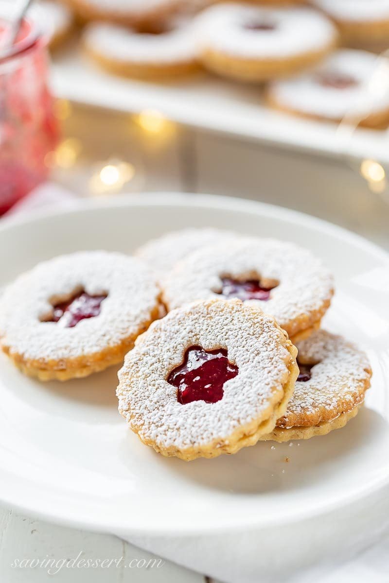 A plate of powder sugared dusted Linzer cookies