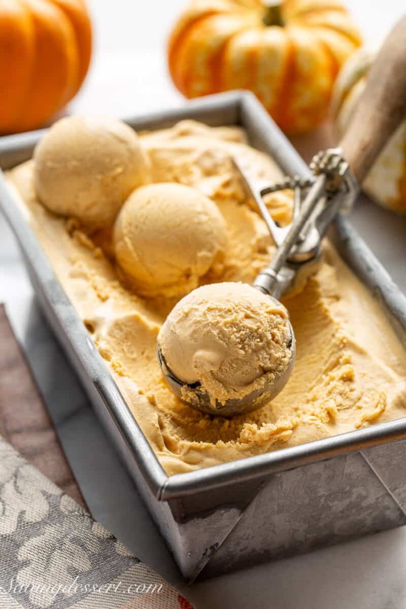 Scoops of pumpkin ice cream in a loaf pan.
