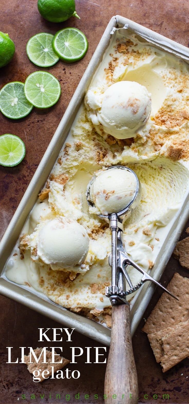 A loaf pan filled with Key Lime Pie Gelato with a ribbon of crushed graham crackers