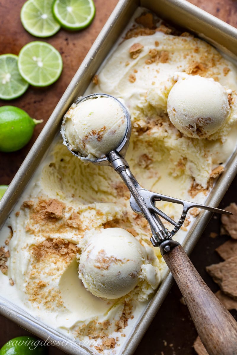 A loaf pan filled with key lime pie gelato with a ribbon of crushed graham crackers