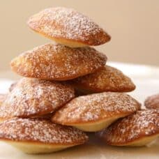 Stack of Madeleine Cookies on a plate.