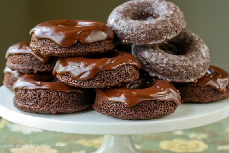 Rich chocolate doughnuts on a cake stand