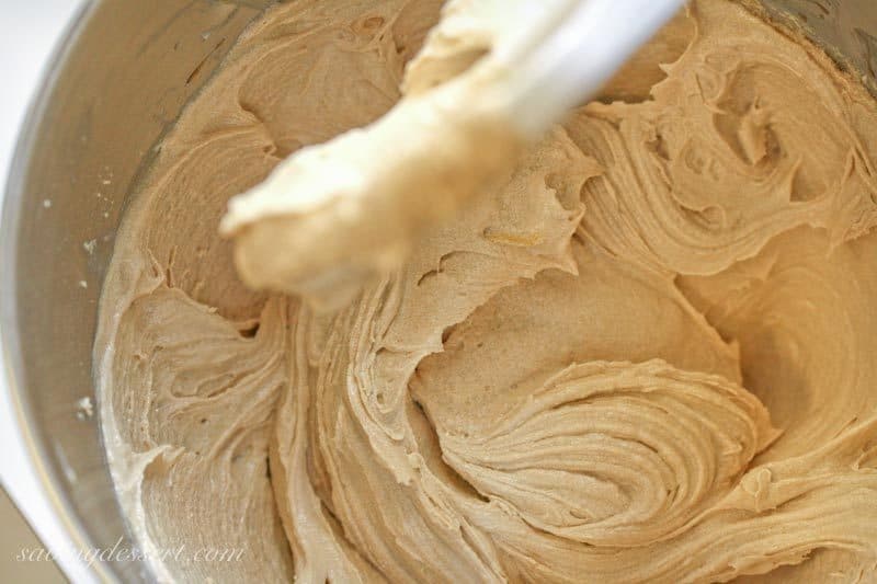 An overhead view of a mixing bowl filled with cookie dough