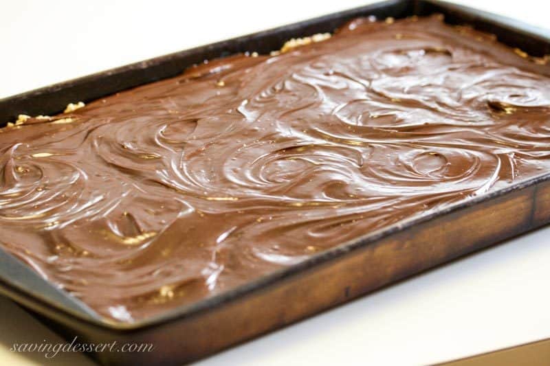 Chocolate peanut butter revel bars covered with melted chocolate