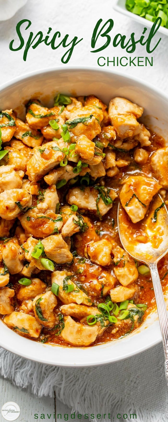 Spicy Basil Chicken Recipe - tender chunks of chicken sautéed in a well spiced sauce with plenty of fresh garlic, basil and minced shallots. This is a terrific chicken dish you'll want to put on repeat! #savingroomfordessert #chicken #spicybasilchicken #thaibasilchicken #basilchicken #asianchicken #easydinner