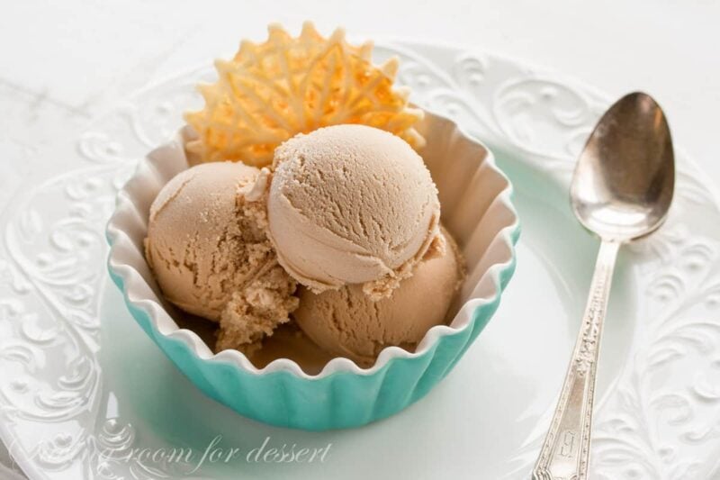 Overhead view of Chai Gelato in a bowl with a Pizzelle.