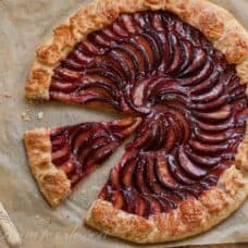 Overhead view of a plum galette sliced