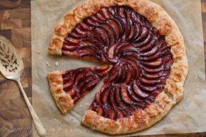 Overhead view of a plum galette sliced