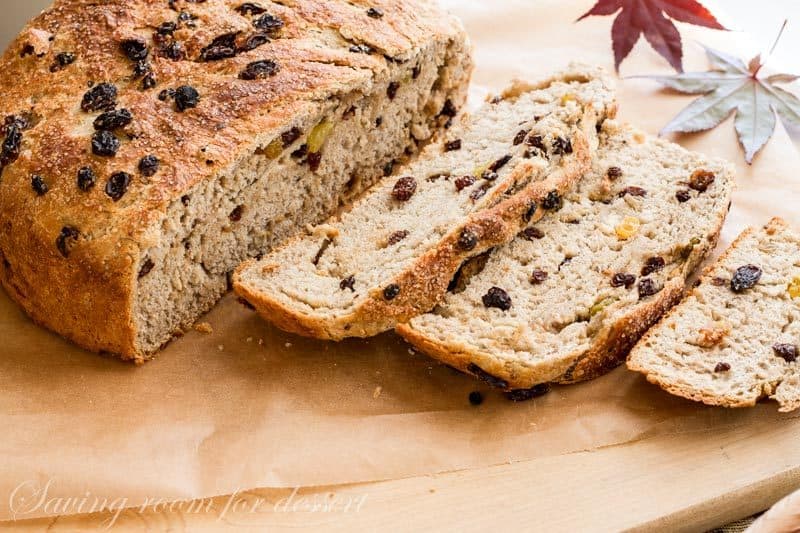 A sliced loaf of Barmbrack Irish Halloween Bread loaded with plump raisins
