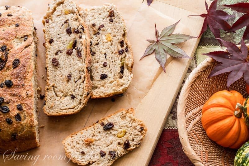 Sliced raisin filled bread on a cutting board