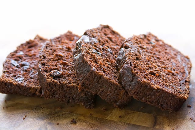 sliced chocolate zucchini bread on a cutting board