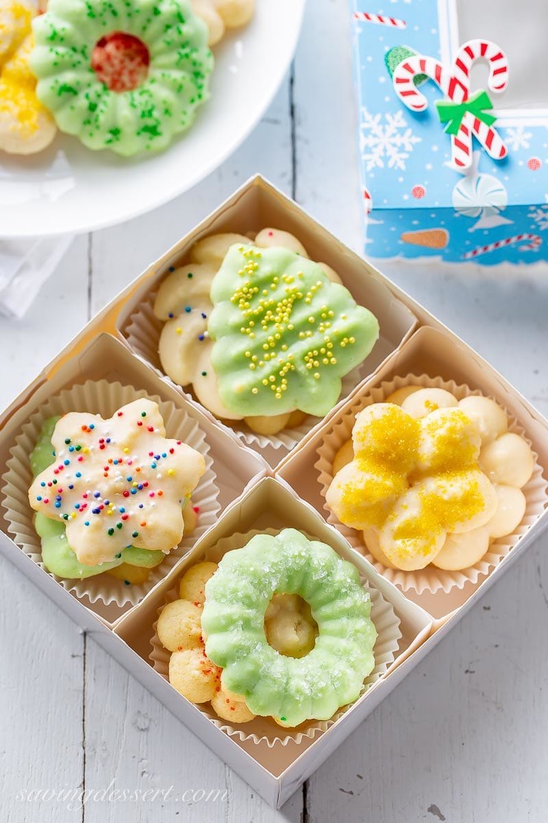 A box of homemade Spritz cookies decorated with sprinkles