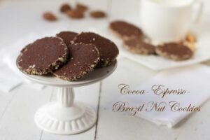 Cocoa-Espresso-Brazil Nut Cookies on a cake stand