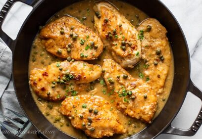 A skillet of chicken piccata with capers