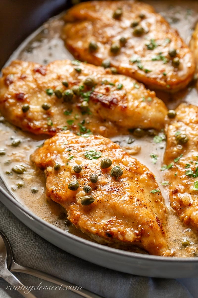 A skillet of chicken piccata