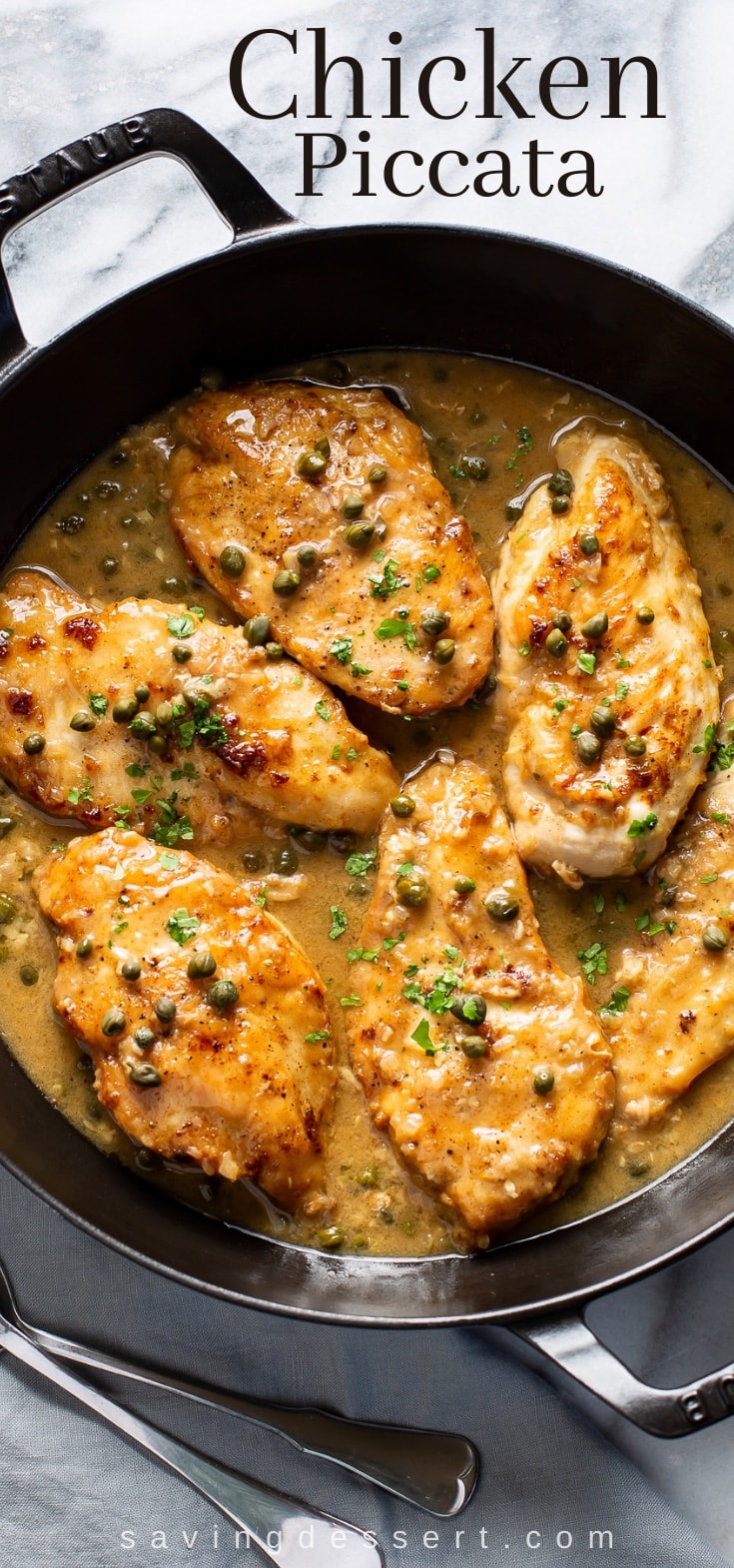 Skillet of Chicken Piccata with capers in a lemon wine sauce