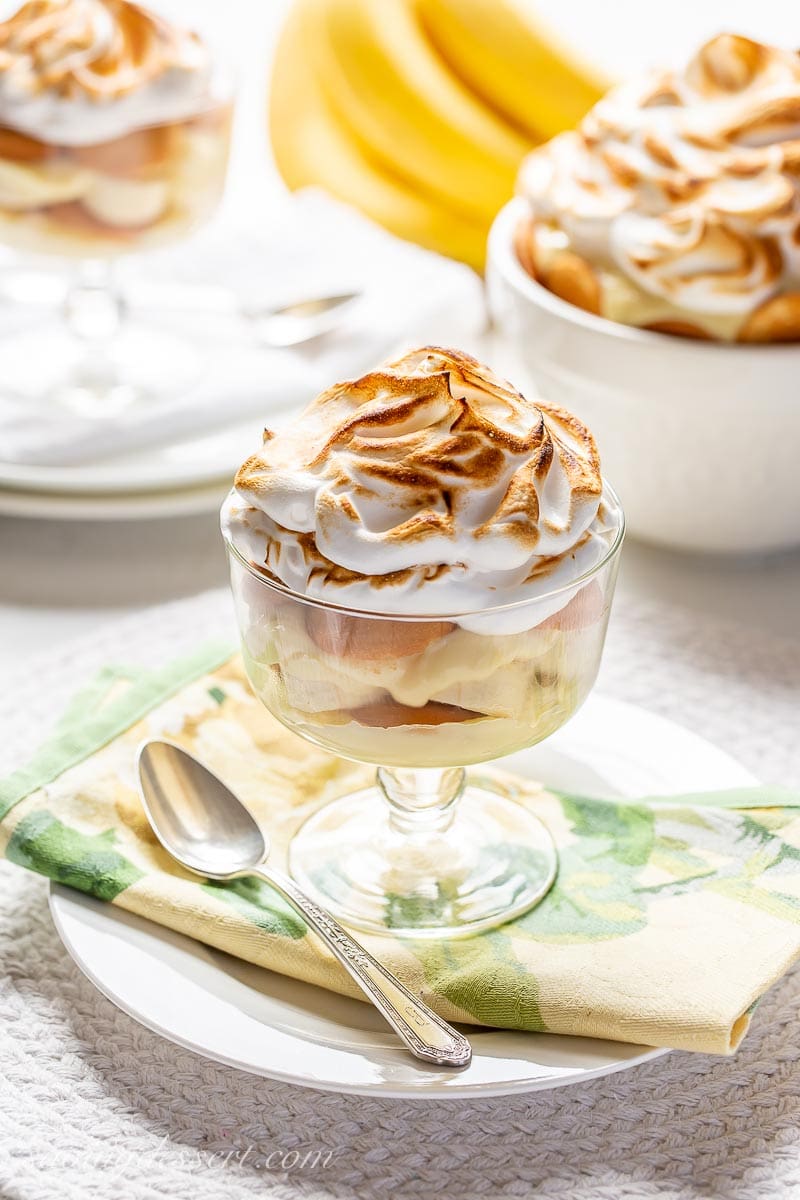 a clear serving dish filled with meringue with a napkin and spoon