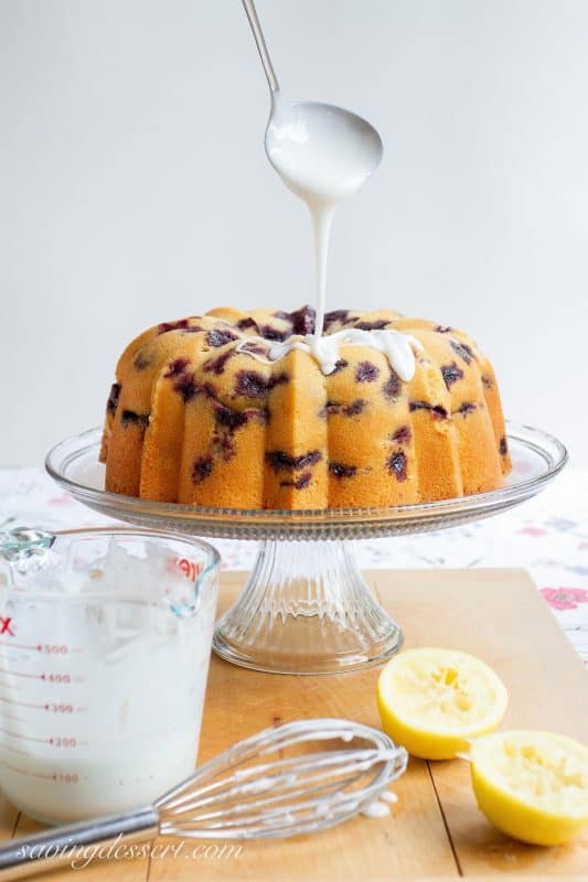 Blueberry Lemon Pound Cake - A deliciously moist classic pound cake stuffed full of ripe, juicy blueberries then drizzled with a simple lemon icing.