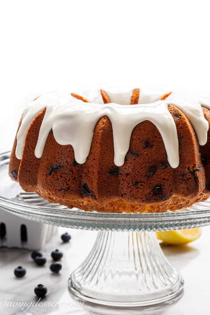 A blueberry pound cake with white icing.