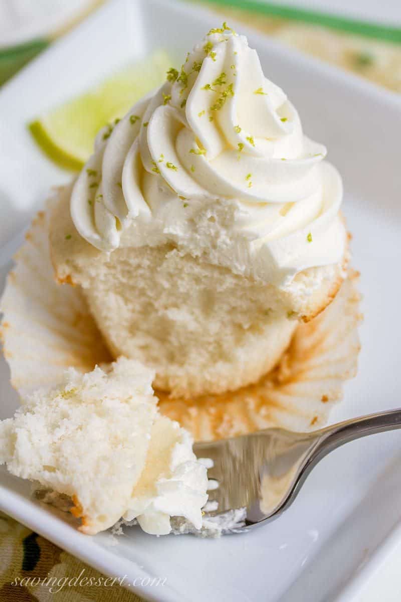 Tender white Lime Cupcakes with Swiss Lime Buttercream and just the right amount of zing from the lime juice www.savingdessert.com