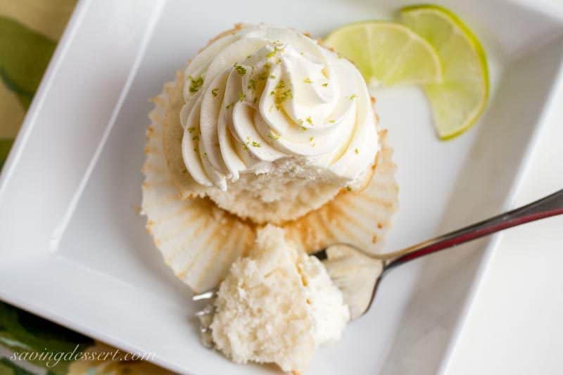 Tender white Lime Cupcakes with Swiss Lime Buttercream and just the right amount of zing from the lime juice www.savingdessert.com