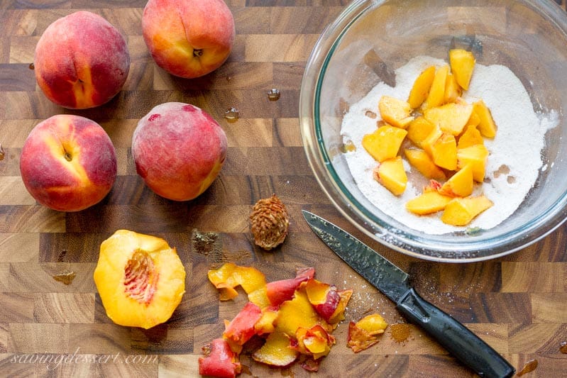 A bowl of diced fresh peaches tossed in sugar