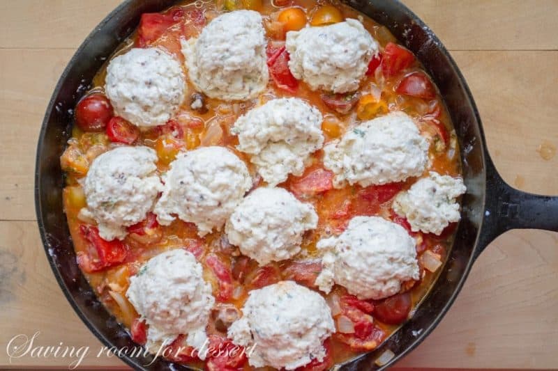 tomato cobbler with herbed biscuit topping ready to go in the oven