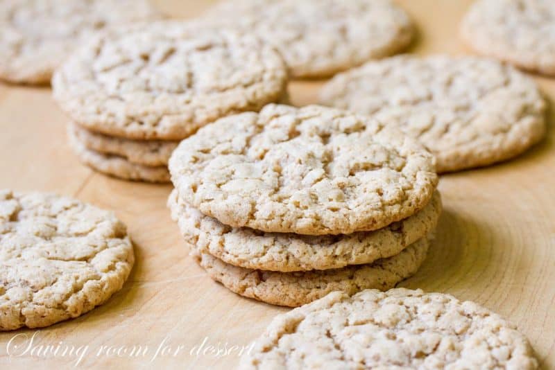 A side view of oatmeal cookies on a cutting board