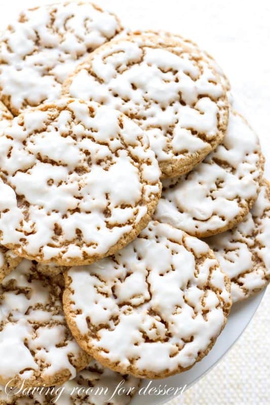 Iced Oatmeal Cookies stacked on a cake stand