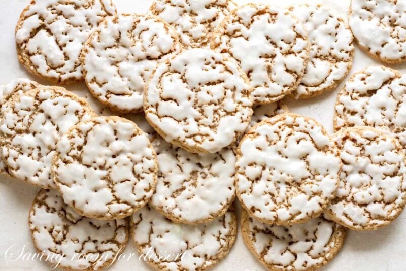 Iced Oatmeal Cookies stacked on marble