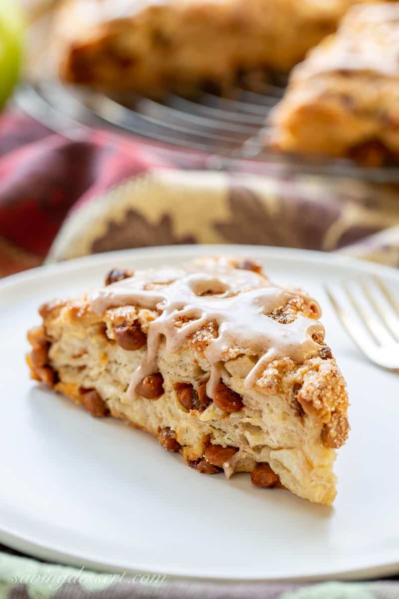 A flaky apple cinnamon scone with cinnamon chips peaking through