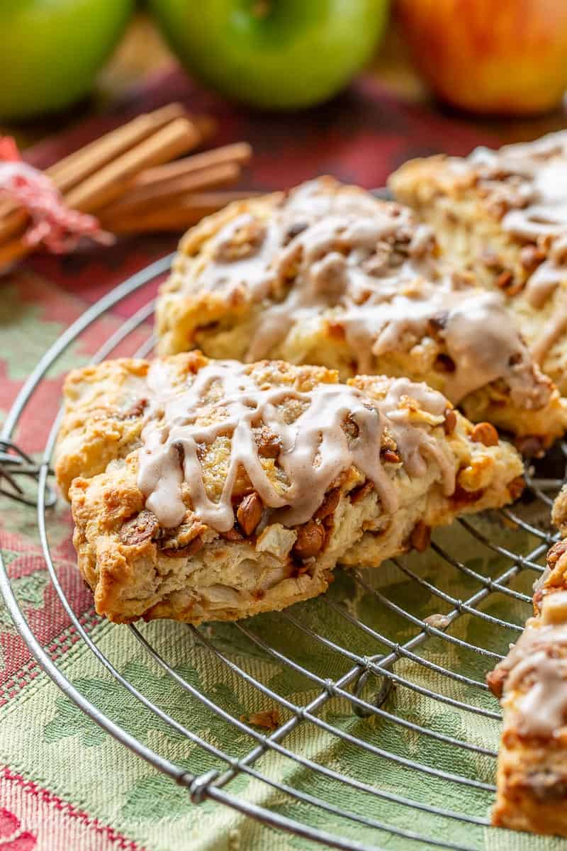 Scones on a cooling rack drizzled with cinnamon icing