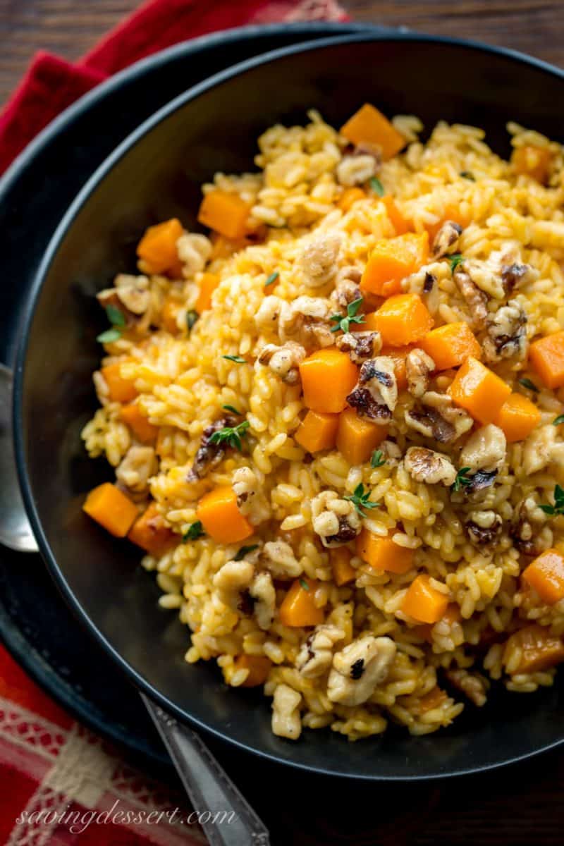 A bowl of butternut squash risotto with candied walnuts