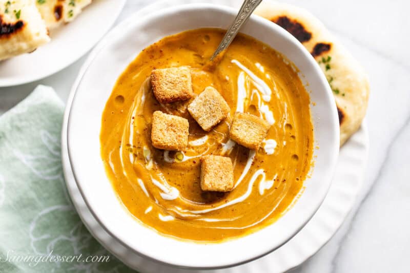 A closeup of a bowl of silky smooth butternut squash soup.