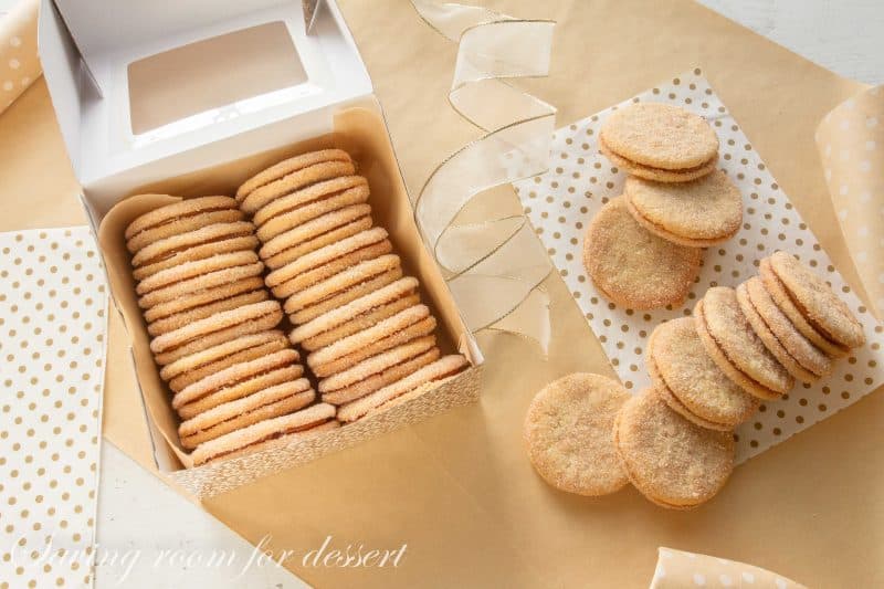 Dulce de Leche Sandwich Cookies with Cinnamon and Cardamom - a sweet, soft cookie coated with the warm flavors of cinnamon and cardamom then filled with a silky rich caramel. www.savingdessert.com #holidaycookies #cookie #dulcedeleche #sandwichcookies #savingroomfordessert