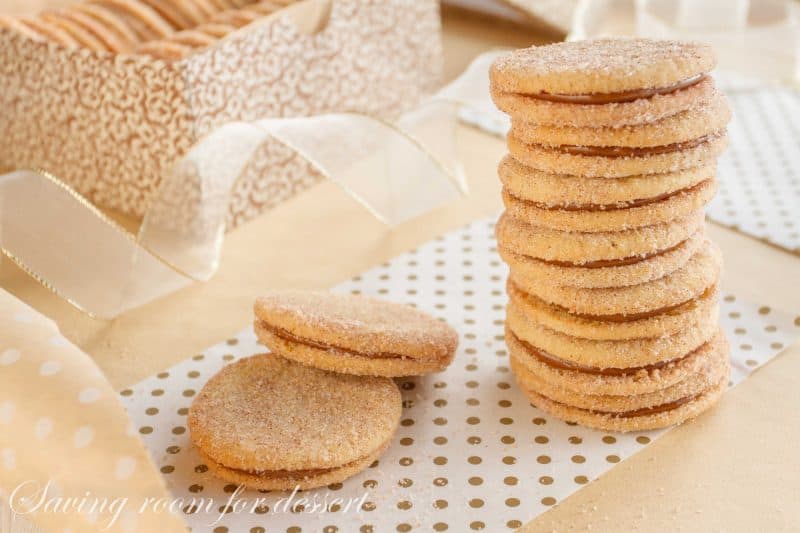 Dulce de Leche Sandwich Cookies with Cinnamon and Cardamom - a sweet, soft cookie coated with the warm flavors of cinnamon and cardamom then filled with a silky rich caramel. www.savingdessert.com #holidaycookies #cookie #dulcedeleche #sandwichcookies #savingroomfordessert