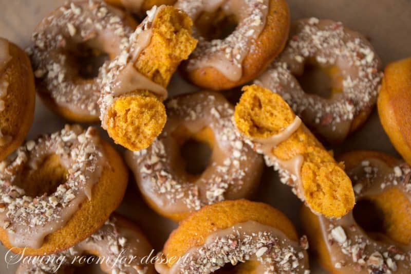 Pumpkin Donuts with Caramel Icing and Toasted Pecans | www.savingdessert.com