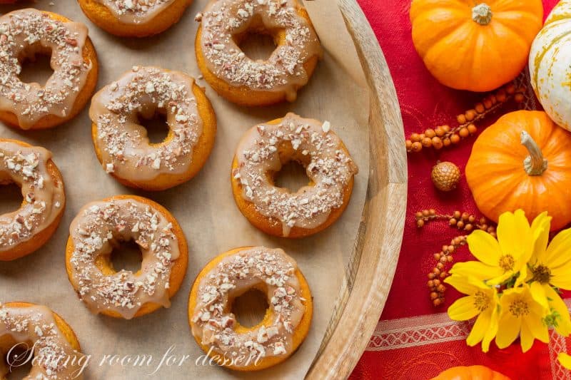 Pumpkin Donuts with Caramel Icing and Toasted Pecans | www.savingdessert.com