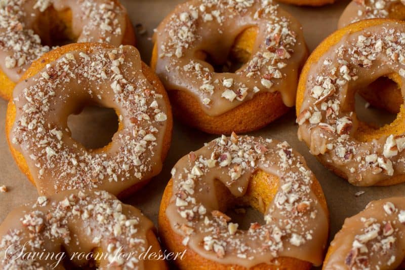 Pumpkin Donuts with Caramel Icing and Toasted Pecans | www.savingdessert.com