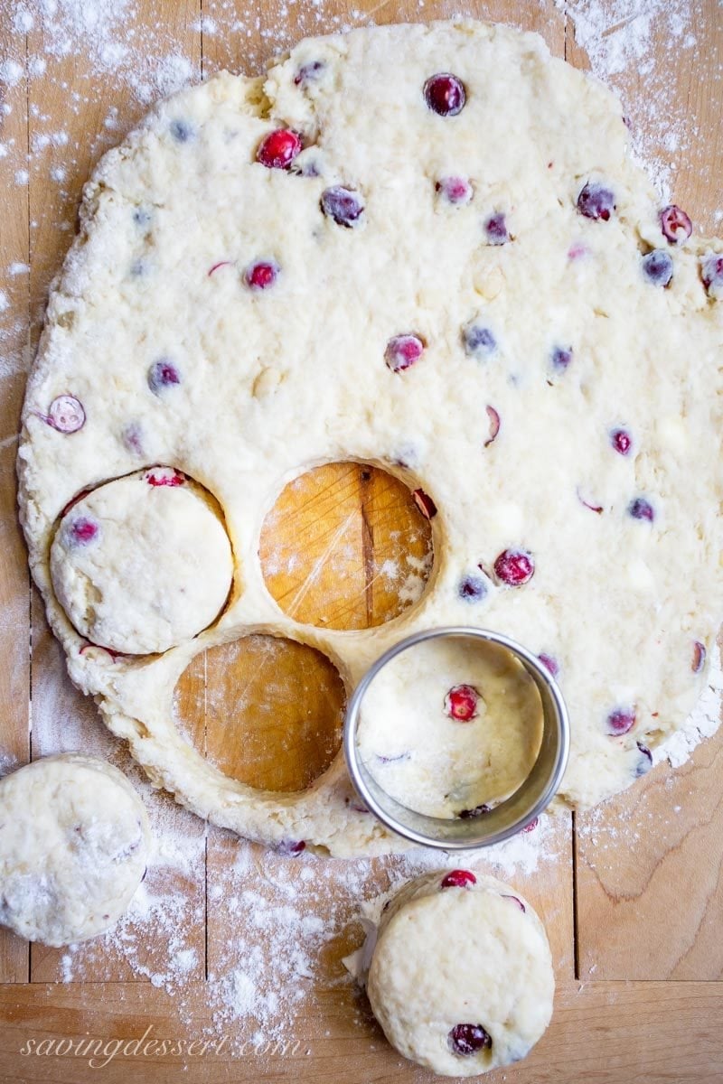 Cranberry almond scone dough rolled out and cut with a biscuit cutter