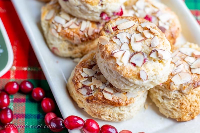 a plate of fresh cranberry scones with almonds