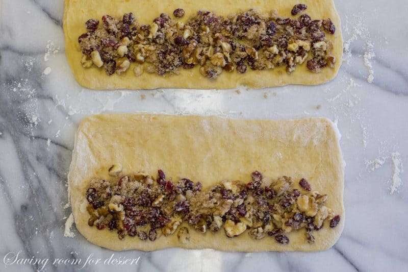 Cranberry Orange Walnut Sweet Bread - it's subtle orange flavor; soft, tender crumb, and surprise sweet fruit and nut filling are sure to please gift recipients and guests alike. www.savingdessert.com