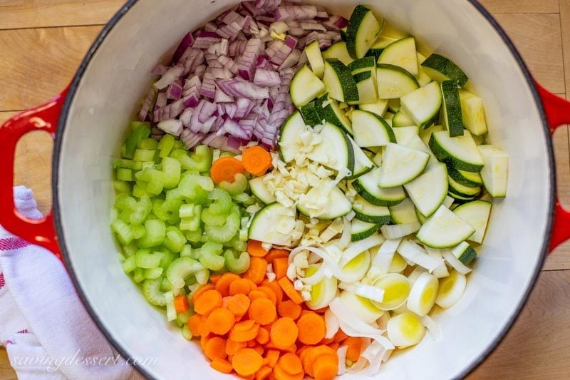 chopped vegetables in a Dutch oven - ready for soup