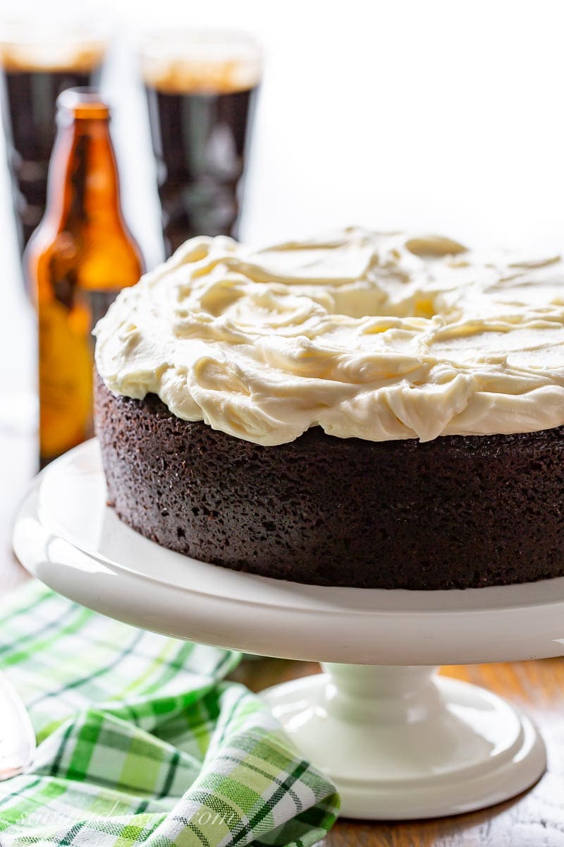 A dark chocolate Guinness Cake on a cake stand