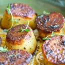 Close up of roasted potatoes with fresh thyme