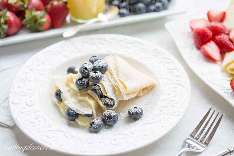 Crepes with Lemon Curd Whipped Cream - Perfectly fresh fruit served with homemade crepes with sweet, tart, bright and creamy lemon curd whipped cream.