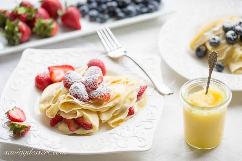 Easy Crepes with Lemon Curd Whipped Cream and fresh fruit | strawberries | blueberries | lemon curd | crepes | lemon whipped cream | www.savingdessert.com