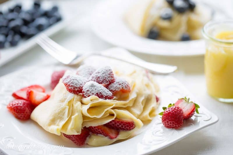 Crepes with Lemon Curd Whipped Cream - Perfectly fresh fruit served with homemade crepes with sweet, tart, bright and creamy lemon curd whipped cream.