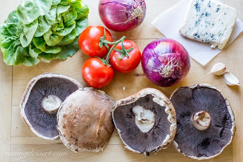 lettuce, onions, tomatoes, blue cheese and portobello mushrooms